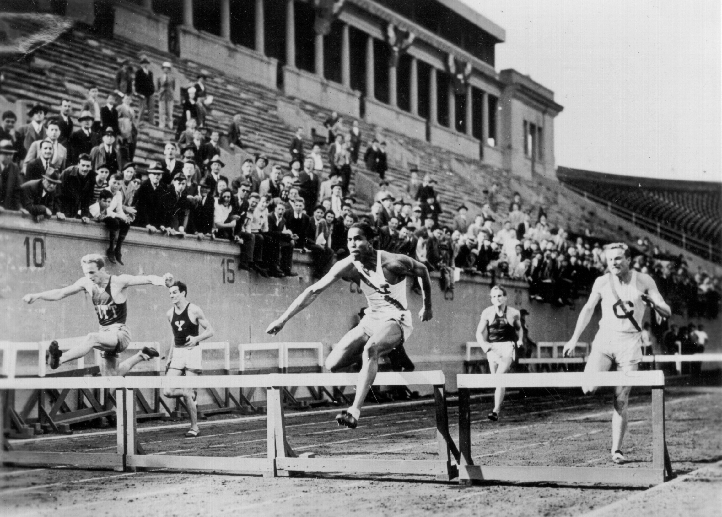 Edward Dugger wins the 220-yard low hurdles at Harvard Staduim, June 1, 1940