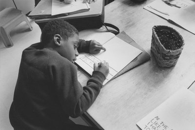 Boy writing, undated, Eliot-Pearson Department of Child Development, http://hdl.handle.net/10427/3462 records, 