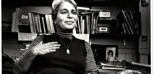 Black and white photograph of Professor Zella Luria at her desk. This photo is from the Office of Communications and Marketing Records, circa 1861 -- 2018.