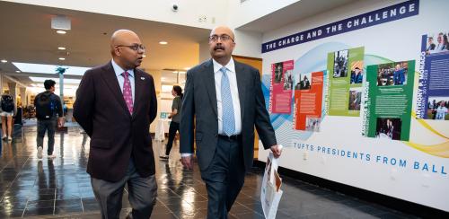Marty Ray and Sunil Kumar walk through the exhibit space, October 6, 2023.