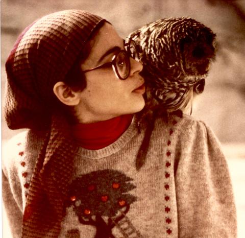 Person with an owl on their shoulder.