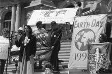 Black and white photograph of Lois Gibbs speaking at Earth Day in Albany, New York 04-22-1996