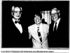 Black and white photo of three men smiling in front of a window with a dark silhouette. The caption of this photo reads "A rare photo of Giantman in the background, seen silhouetted in the window. Photo courtesy of Giantman sycophants." The Tufts Daily, 10 November 1994.