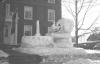Snow sculpture depicting Jumbo in front of a birthday cake.