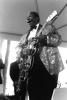 Black and white image of B.B. King onstage with a guitar.